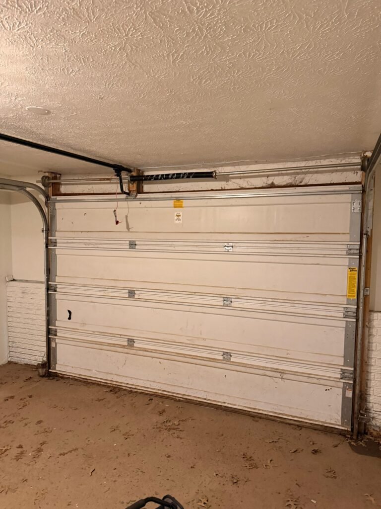 Legacy Garage Door technician on a garage door repair job